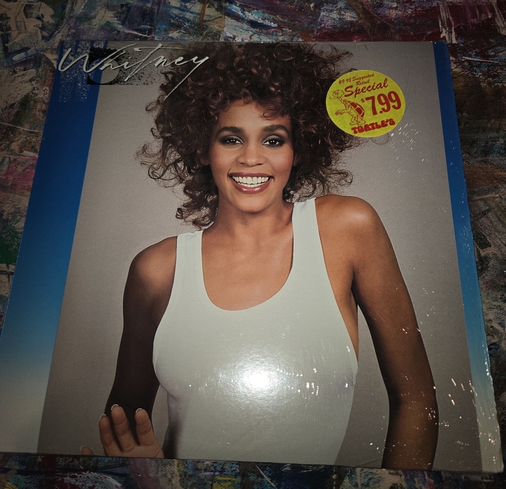 Whitney Album Cover Featuring Woman in White Tank Top